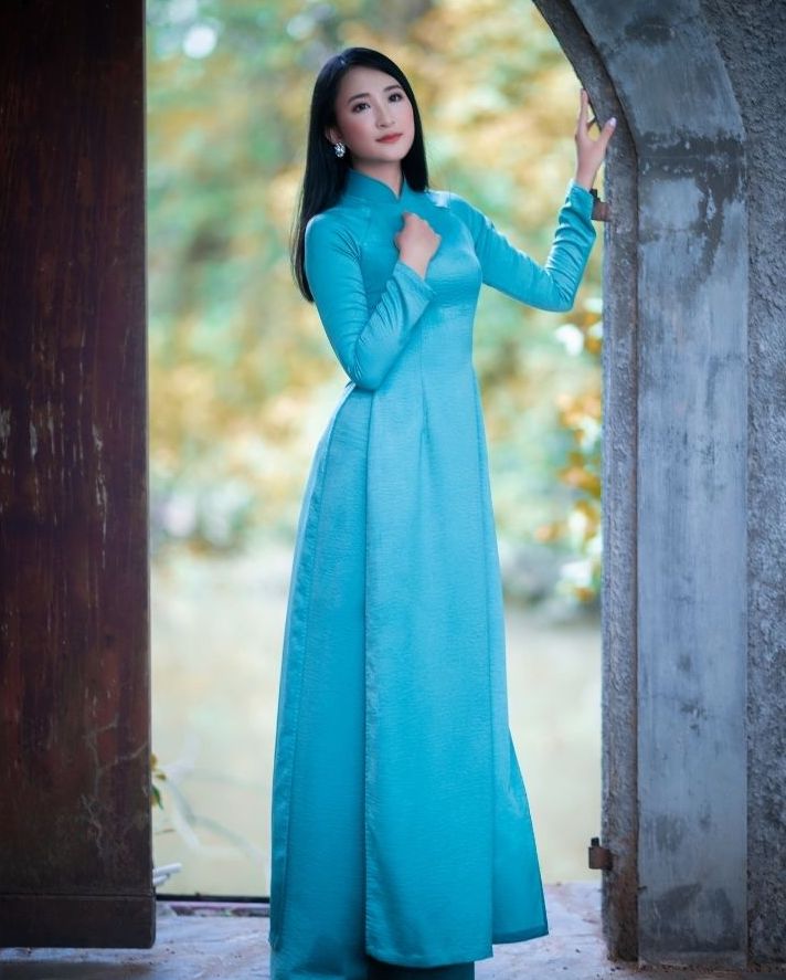 Asian woman in blue dress