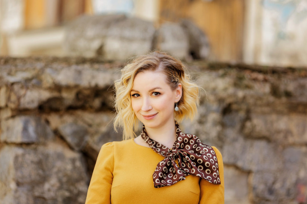 Young blonde girl in a yellow dress