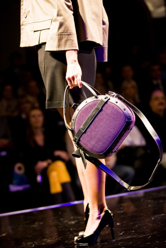 woman with purple suitcase