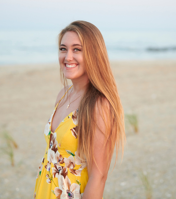 Beautiful young blonde woman in pretty yellow dress