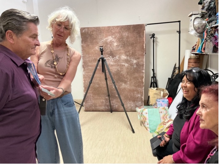 Lori shows off Bob's color palette to an audience.