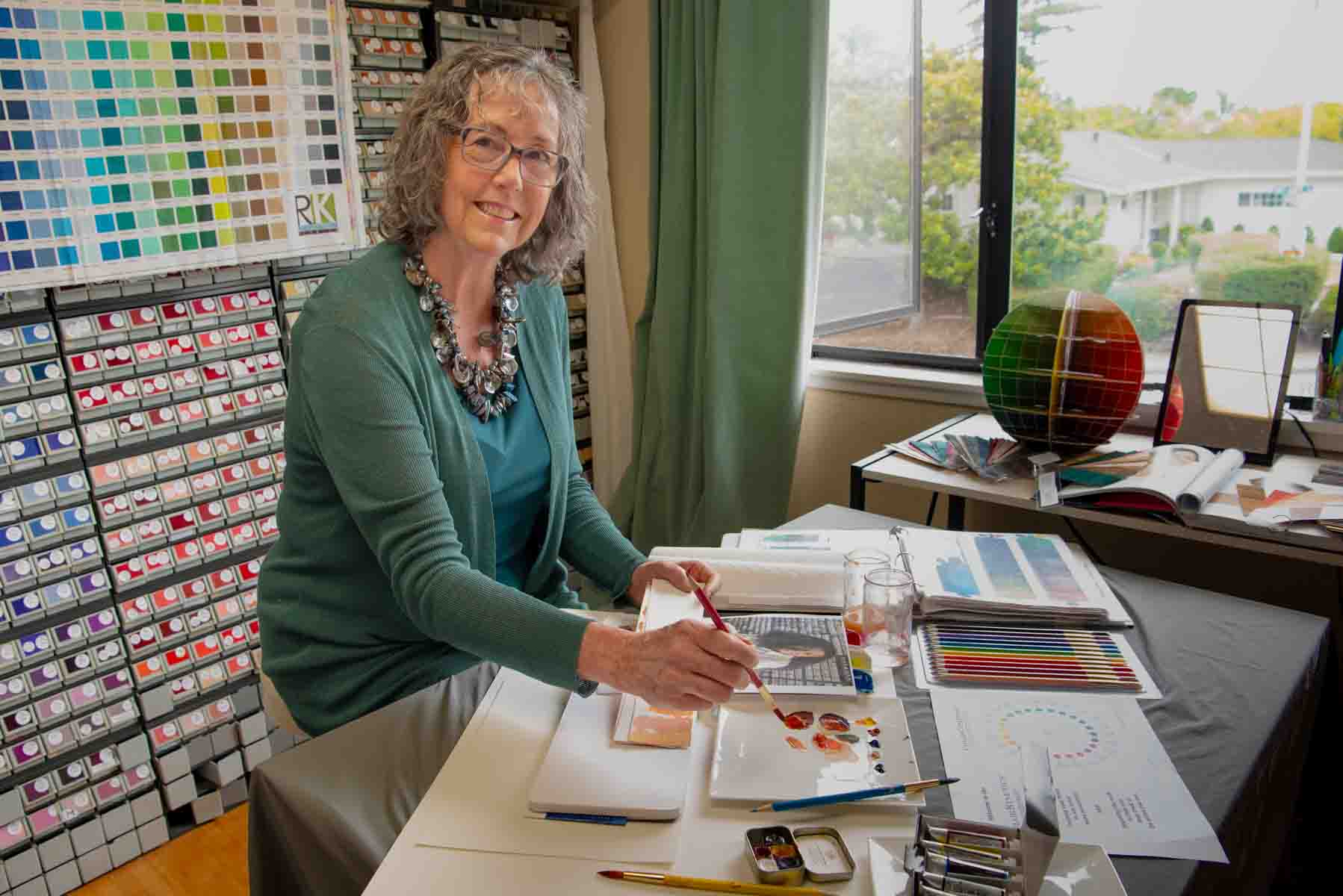 Mary Lou Manlove sitting in her color room.
